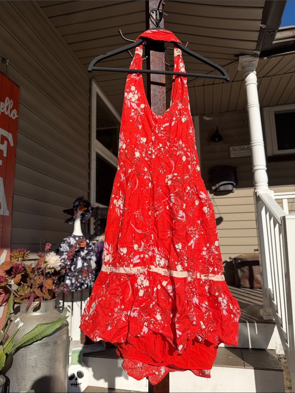 Free People Womenโs Cherry Red Floral Halter Sundress with Ruffle Hem
